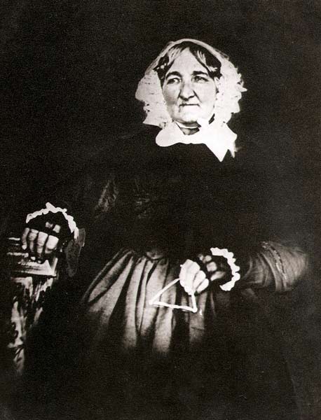 A photograph of Charlotte Kemp in later life in a seated position