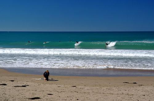 Surfing at Wainui Beach, Gisborne
