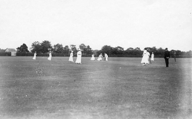 Women playing cricket