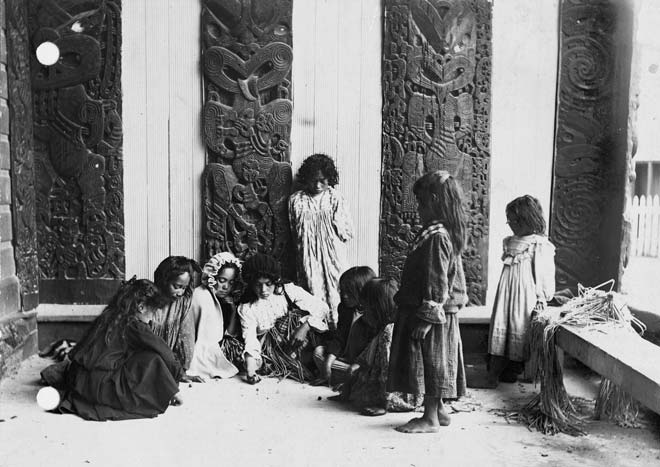 Children playing marbles at Ōhinemutu, around 1905