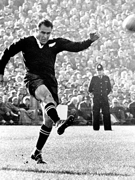 Don Clarke kicks for goal
