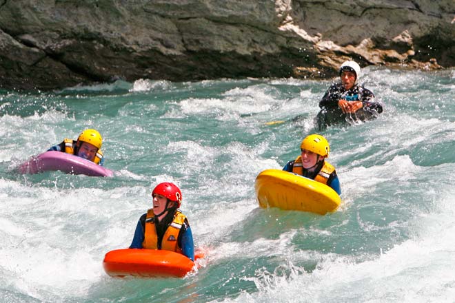 River surfers