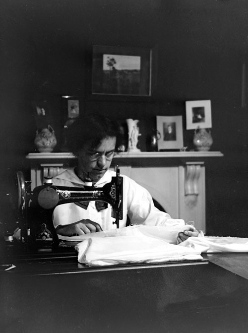 Woman sewing, early 20th century