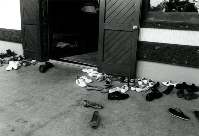 Shoes at the door of the wharenui