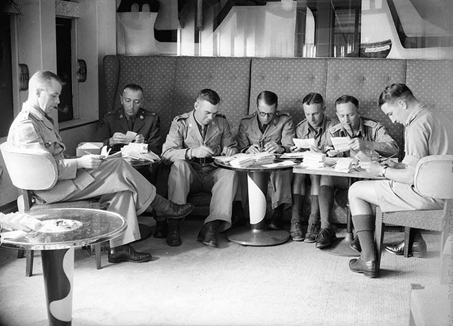 Censoring letters on a troopship, around 1941
