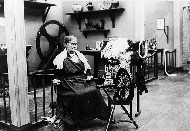 Spinning in the women's court, New Zealand and South Seas Exhibition, 1925–26