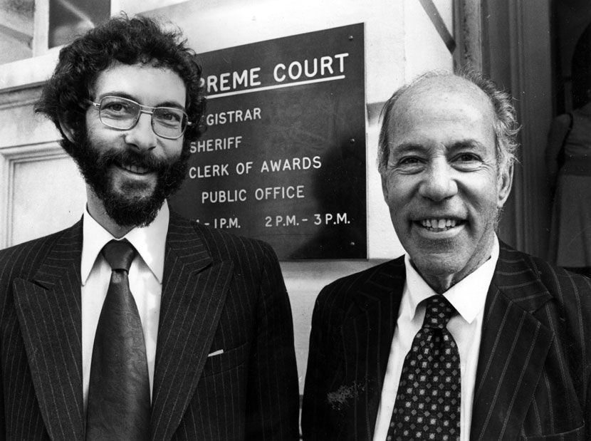 Two men standing side by side