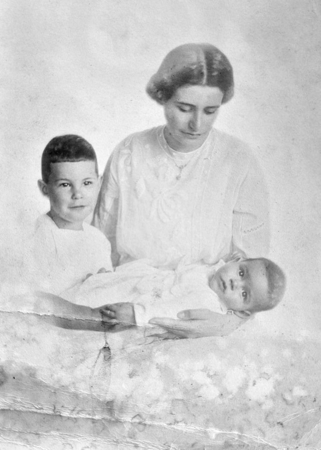 A young woman with a child and a baby