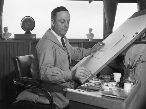James Berry seated at an easel and working on a painting