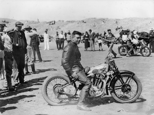 Percy Coleman on a Royal Enfield motorcycle, Waikanae Beach, about 1930