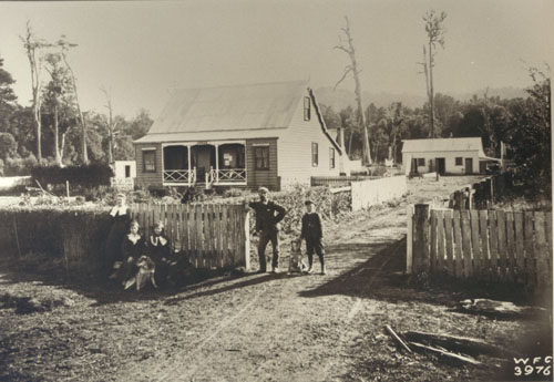 Christian Hansen (second from right) outside the accommodation house at Motu, early twentieth century