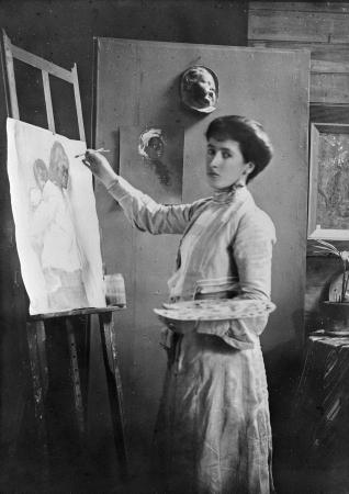 Photograph of Frances Hodgkins painting using an easel