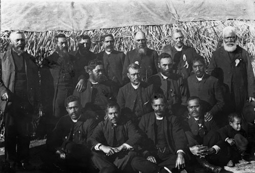 A photograph of a group of Maori men dressed in clerical garb