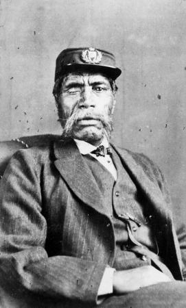 A photograph of Renata Kawepo in a seated position wearing European clothing