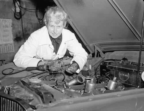 Sybil Audrey Marie Lupp working on a Jaguar at her Wellington garage