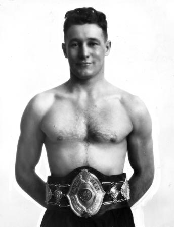 Ted Morgan, Olympic boxing gold medallist in 1928, wearing a championship belt