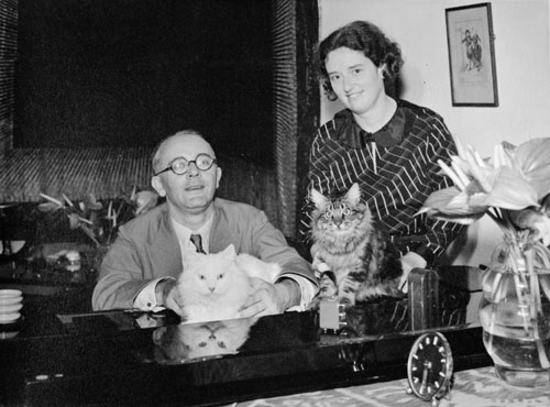 Paul Schramm and Diny Schramm with their cats