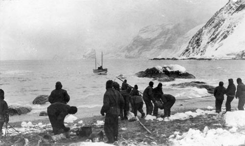 Members of Sir Ernest Shackleton's trans-Antarctic expedition on Elephant Island, farewelling the James Caird