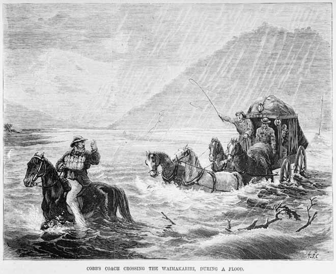A man sitting on a horse leading a horse drawn carriage full of passengers and luggage across a flooded river.