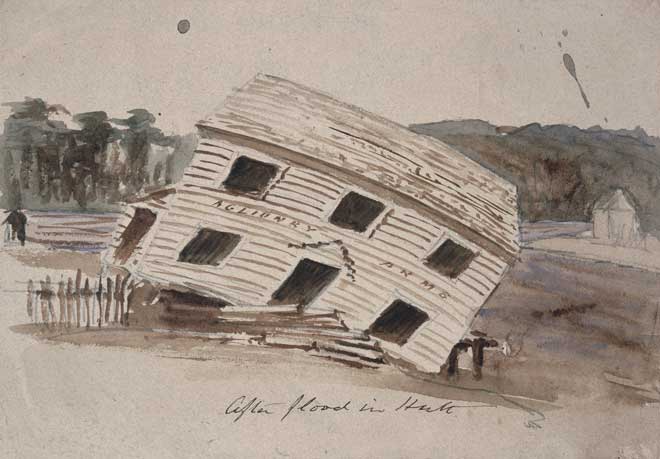 A two-storey wooden building falling down into a river.