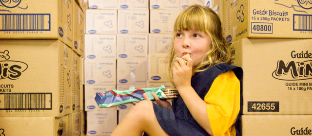 Jane Findlay, from St Mary's Pippins group, samples a Girl Guide biscuit