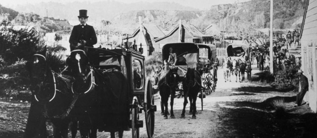 A funeral cortège moves through Hokitika, 1914