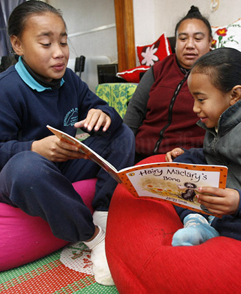 Children reading one of Lynley Dodd's celebrated Hairy Maclary books