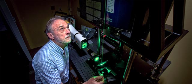 NIWA physicist Ben Liley adjusting a LIDAR