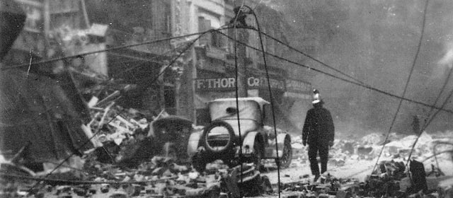 Fireman in the wreckage of the Napier earthquake