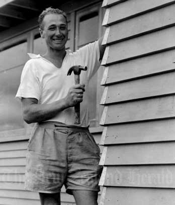 A Dutch immigrant in front of his house