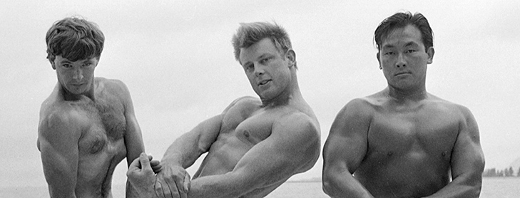 Muscle men posing