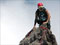 Climber on top of rocky peak