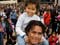All Black rugby player Rodney So'oialo, his wife Marilyn and their child
