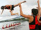 Hamilton Boys’ High School rowers throw their cox into Lake Karapiro after winning the Maadi Cup