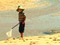 Boy playing with net on beach