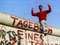Liam Jeory straddles the Berlin Wall