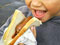 Children enjoy a sausage sizzle at Prospect School in Auckland, 2008