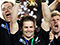All Black captain Richie McCaw (centre) with the Webb Ellis Cup, 2011