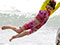 Holidaymakers frolic in the sea at Piha beach, Boxing Day 2009