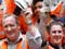 Workers in hi-vis vests and safety helmets