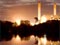 Huntly Power Station lit up at night with Waikato River in foreground