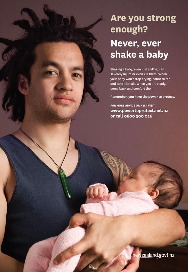 Poster of young Māori man holding a baby with text written in right-hand corner.