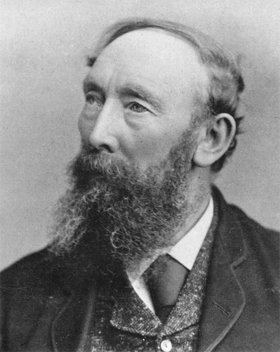 A head and shoulders studio photograph of James Bragge