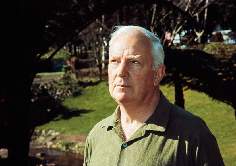 Head and shoulders photograph of Harold Turbott outside in a garden
