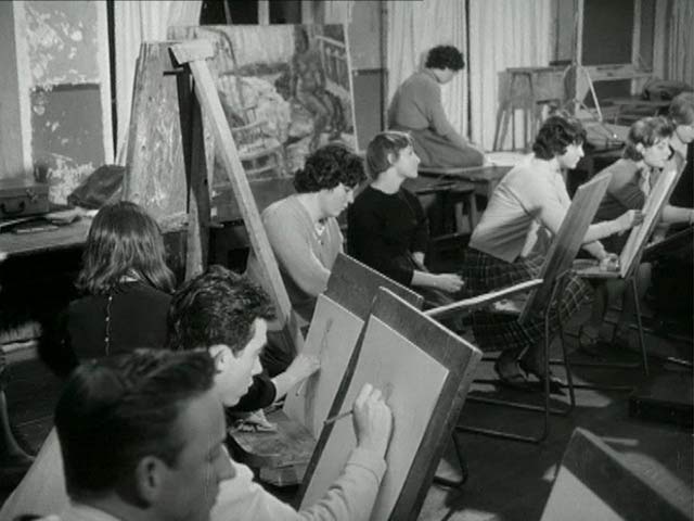 Film of adult students in different classrooms, some scenes including teachers and a skeleton used for their studies