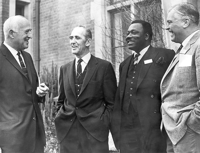 Malcolm McRae Burns (left) and visitors to Lincoln College