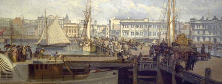 Boats and people mill around docks