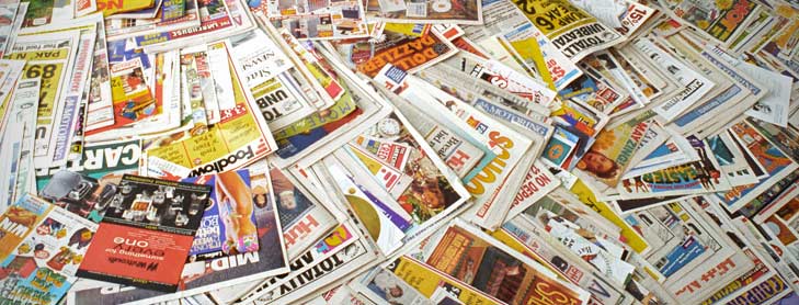 Large pile of magazines spread out