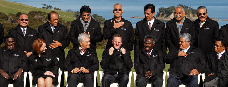 NZ PM John Key sitting with group of international leaders in group photo