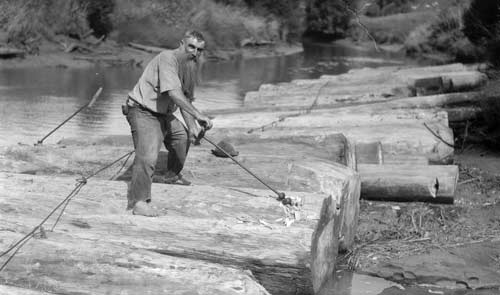 Boring holes for a log raft